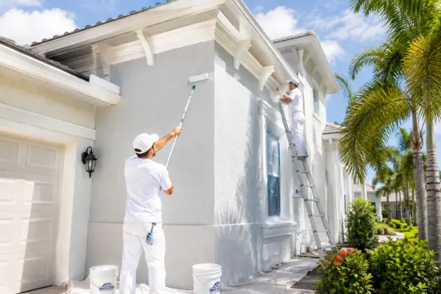 Exterior house painting on a Cape Coral canal home exposed to Florida sun, rain and salt air
